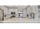Bright kitchen with stainless appliances, island with seating and view to dining and backyard at 332 Aster Ridge Trl, Peachtree City, GA 30269