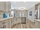 Eat-in kitchen with white cabinets, stainless steel appliances, island with sink and view to backyard at 332 Aster Ridge Trl, Peachtree City, GA 30269