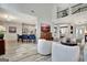 Open-concept living area with a kitchen, breakfast bar, and second-floor overlook at 332 Aster Ridge Trl, Peachtree City, GA 30269