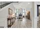 Bright living room features hardwood floors, fireplace, and large windows at 332 Aster Ridge Trl, Peachtree City, GA 30269
