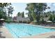 Well-maintained community pool with plenty of seating and shade for residents to unwind at 332 Aster Ridge Trl, Peachtree City, GA 30269