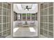 Bright sunroom with skylights, a ceiling fan, and large windows overlooking the yard at 332 Aster Ridge Trl, Peachtree City, GA 30269