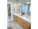 Bathroom featuring a double vanity and an open view of the bathtub at 116 Cardell Farms Rd, Locust Grove, GA 30248