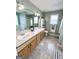Bathroom featuring double vanity, tub, and classic fixtures at 116 Cardell Farms Rd, Locust Grove, GA 30248