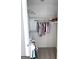 Walk-in closet with shelving, hanging rods, and organized clothes at 116 Cardell Farms Rd, Locust Grove, GA 30248