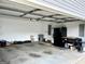 Spacious garage featuring an entry door and plenty of room for storage and parking at 116 Cardell Farms Rd, Locust Grove, GA 30248