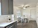 Eat-in kitchen featuring gray cabinets, stainless appliances, white countertops, and a breakfast table at 116 Cardell Farms Rd, Locust Grove, GA 30248