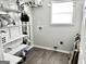 Functional laundry room with shelving, lots of light and hookups at 116 Cardell Farms Rd, Locust Grove, GA 30248