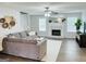 Cozy living room with a decorative fireplace, comfortable seating, and abundant natural light at 116 Cardell Farms Rd, Locust Grove, GA 30248