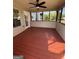 Relaxing screened porch featuring ceiling fan and beautiful views at 116 Cardell Farms Rd, Locust Grove, GA 30248