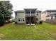 Large backyard and patio perfect for outdoor gatherings and entertaining at 6131 Sparkling Cove Ln, Buford, GA 30518
