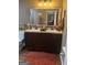 Charming bathroom vanity with double sink, modern fixtures, and framed mirror at 6131 Sparkling Cove Ln, Buford, GA 30518