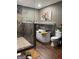 Stunning bathroom featuring standalone tub, tiled shower, and warm wood accents at 6131 Sparkling Cove Ln, Buford, GA 30518