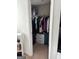 Organized closet with ample storage space and hanging racks for clothes and accessories at 6131 Sparkling Cove Ln, Buford, GA 30518