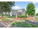 Charming two-story home with a well-manicured front yard with mature landscaping and attached two car garage at 6131 Sparkling Cove Ln, Buford, GA 30518