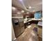 Contemporary kitchen with stainless steel appliances, dark wood cabinets and breakfast bar at 6131 Sparkling Cove Ln, Buford, GA 30518