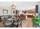 Open kitchen with stainless appliances, ample cabinet space, and a stylish dining table with seating at 6131 Sparkling Cove Ln, Buford, GA 30518