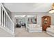 Bright open-concept living area featuring neutral walls and plush carpeting at 6131 Sparkling Cove Ln, Buford, GA 30518