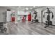 Finished basement with workout equipment, kitchenette with red refrigerator, and a stylish popcorn machine at 110 Sunflower St, Tyrone, GA 30290