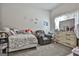 Cozy bedroom retreat with ample natural light, comfortable seating and dresser at 110 Sunflower St, Tyrone, GA 30290