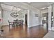 Spacious dining room featuring a modern chandelier and wainscoting for a stylish touch at 110 Sunflower St, Tyrone, GA 30290