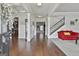 Bright and open foyer with hardwood floors, staircase, and elegant decor at 110 Sunflower St, Tyrone, GA 30290