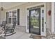 Close-up of the front door, with a glass door, surrounded by beautiful sidelights at 110 Sunflower St, Tyrone, GA 30290