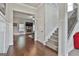 The hallway leads to a living room and staircase with hardwood floors and neutral walls at 110 Sunflower St, Tyrone, GA 30290