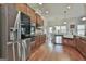 Well-equipped kitchen with stainless steel appliances and warm wood cabinets provides a cooking haven at 110 Sunflower St, Tyrone, GA 30290