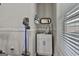 This laundry room features white cabinets, stainless steel sink, and a convenient wall-mounted vacuum at 110 Sunflower St, Tyrone, GA 30290