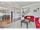 View of a living room with a cozy red sofa and decorative fireplace at 110 Sunflower St, Tyrone, GA 30290