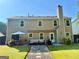 Spacious backyard with patio area, perfect for outdoor entertaining and relaxation with a large chimney at 5388 Silver Springs Dr, Sugar Hill, GA 30518