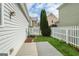 Backyard featuring a deck, picket fence, and manicured lawn at 747 Gardenside Cir, Marietta, GA 30067