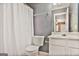 Bathroom with gray walls, white vanity and toilet, and white shower curtain at 747 Gardenside Cir, Marietta, GA 30067