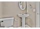 Bathroom featuring a toilet, a pedestal sink, and a towel rack at 747 Gardenside Cir, Marietta, GA 30067