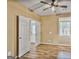 Vaulted ceiling bedroom features hardwood floors, large windows, and double doors at 747 Gardenside Cir, Marietta, GA 30067