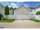 Detached two-car garage, with white siding and a white picket fence at 747 Gardenside Cir, Marietta, GA 30067