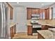 Well-equipped kitchen with stainless steel appliances, granite countertops, and ample cabinet space for storage at 747 Gardenside Cir, Marietta, GA 30067