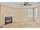 Comfortable living room features a cozy fireplace with a black hearth and mantle, along with sleek hardwood floors at 747 Gardenside Cir, Marietta, GA 30067
