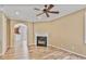 Open-concept living room featuring a fireplace, wood floors, and an archway to the kitchen, promoting seamless flow at 747 Gardenside Cir, Marietta, GA 30067