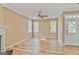 Spacious living room with hardwood floors, a ceiling fan, and an abundance of natural light from the many windows at 747 Gardenside Cir, Marietta, GA 30067