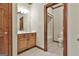 Bathroom featuring wood trim, a large mirror and granite counters at 3530 Highway 81 W, Hampton, GA 30228