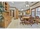 Bright dining space features tile flooring, a wooden table, and seamlessly connects to the kitchen at 3530 Highway 81 W, Hampton, GA 30228