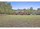 Charming brick home with ample yard space, surrounded by mature trees offering privacy and a tranquil setting at 3530 Highway 81 W, Hampton, GA 30228
