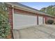 Spacious three car attached garage, providing ample storage and parking space for vehicles and equipment at 3530 Highway 81 W, Hampton, GA 30228