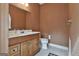 Charming half bath with vanity, toilet, and paneled wall at 3530 Highway 81 W, Hampton, GA 30228
