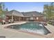 Beautiful backyard swimming pool with a waterfall feature, surrounded by a well-maintained patio and lush landscaping at 3530 Highway 81 W, Hampton, GA 30228
