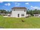 View of the backyard featuring green grass and the back of the home at 7770 Hana Court Ct, Jonesboro, GA 30236