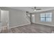 Bright and airy living room with hard surface flooring, staircase, and plenty of natural light at 7770 Hana Court Ct, Jonesboro, GA 30236