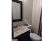 Bathroom featuring a vanity, toilet, and a framed mirror at 5840 Butner Rd, South Fulton, GA 30349